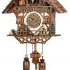 Frankenmuth Clock Company View All KU468QM - Quartz Musical Chalet With Wood Chopper